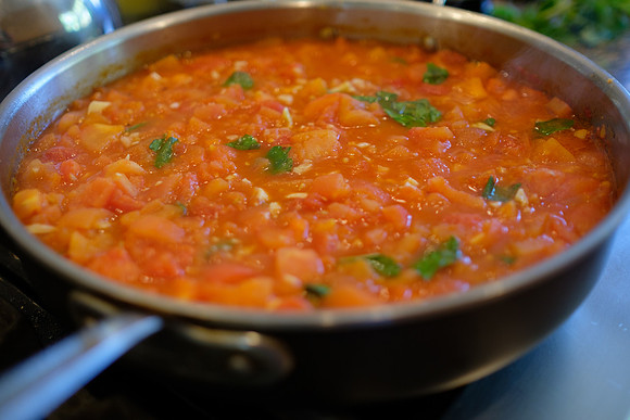 untitled-23Simmer till tomato begins to break down, but remains chunky. Add torn basil.